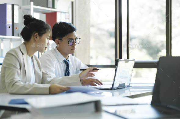 Businesspeople are working, discussing, analyzing using laptop and statistic. - Stock Photo - Images