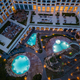 Aerial view of several pools in the spa center on a sea coast at night - PhotoDune Item for Sale