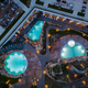 Aerial view of several pools in the spa center on a sea coast at night - PhotoDune Item for Sale