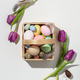Easter composition with Pink tulips and basket with eggs on white background - PhotoDune Item for Sale