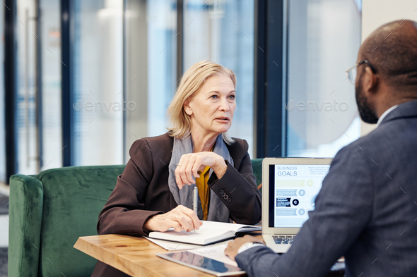 Lawyers discussing in team at meeting - Stock Photo - Images