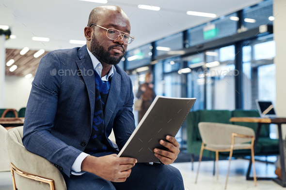 Businessman with report preparing for the meeting - Stock Photo - Images