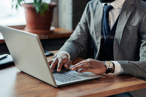 Businessman working online on laptop - Stock Photo - Images