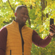 Banner african American man taking a self portrait with a smartphone in autumn fall park copy space - PhotoDune Item for Sale
