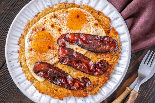 Hash brown with egg and bacon - Stock Photo - Images