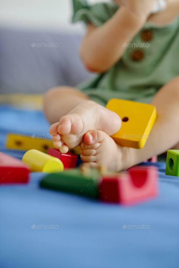 Girl Playing with Wooden Bricks - Stock Photo - Images