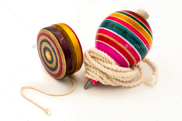 Colorful yo-yo and trompo on a white background