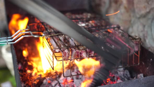 Lamb Ribs Cooked Over an Open Fire Closeup in  alt