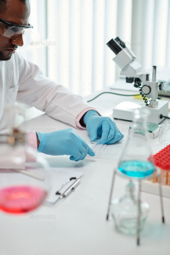 Laboratory Worker Checking Blood - Stock Photo - Images