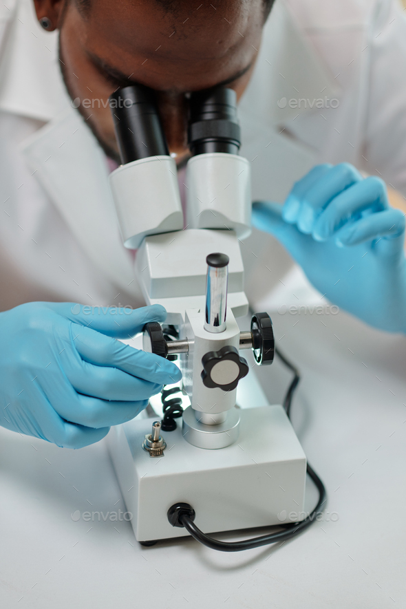 Researcher Working with Microscope - Stock Photo - Images