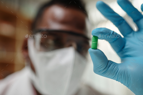 Scientist Showing Green Pill - Stock Photo - Images