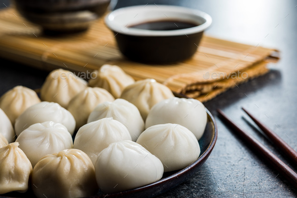 Xiaolongbao, traditional steamed dumplings. Xiao Long Bao buns on plate. - Stock Photo - Images