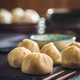 Xiaolongbao, traditional steamed dumplings. Xiao Long Bao buns on cutting board. - PhotoDune Item for Sale