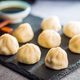 Xiaolongbao, traditional steamed dumplings. Xiao Long Bao buns on cutting board. - PhotoDune Item for Sale
