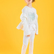 A teenage girl in white clothes posing on a yellow background. The girl lowered her jacket to her - PhotoDune Item for Sale
