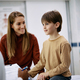 Happy boy and his mother talking to pediatrician at doctor&#39;s office. - PhotoDune Item for Sale