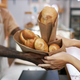 Bakery Worker Giving Packagers to Customer - PhotoDune Item for Sale