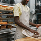 Bakery Worker Wrapping Bread - PhotoDune Item for Sale