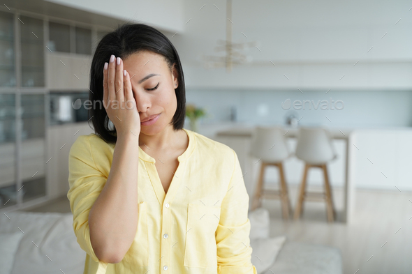 Facepalm, oh no. Upset female cover face with palm, feel regret blaming herself for failure at home - Stock Photo - Images