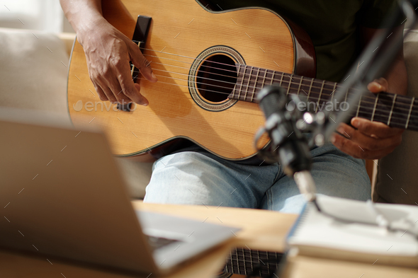 Artist Recording Himself Playing Guitar - Stock Photo - Images