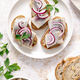 Herring sandwich. Open sandwiches with whole grain bread, herring and onion. Top view - PhotoDune Item for Sale