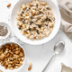 Oatmeal bowl. Oat porridge with nuts, apple, chia seeds and pumpkin seeds for healthy breakfast - PhotoDune Item for Sale