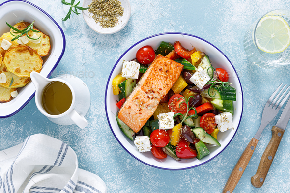 Greek salad with grilled salmon fish. Traditional mediterranean cuisine. Healthy food, diet - Stock Photo - Images