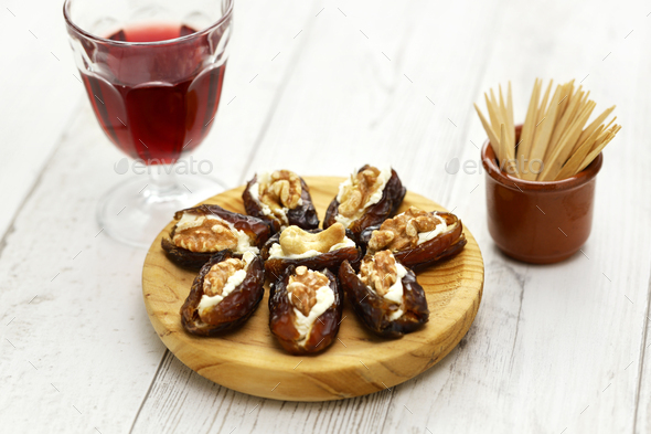 stuffed dates with cream cheese and nuts, appetizer - Stock Photo - Images