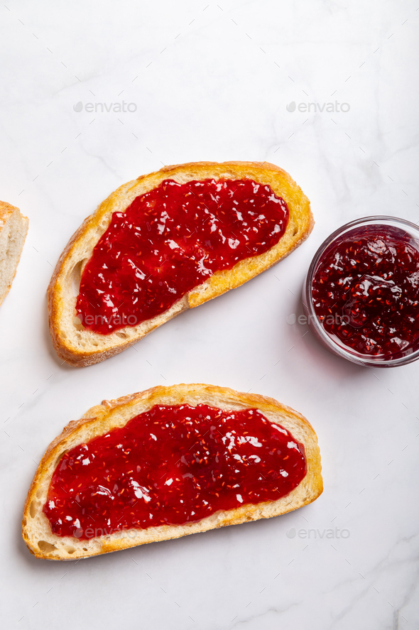 Raspberry jam on toast - Stock Photo - Images