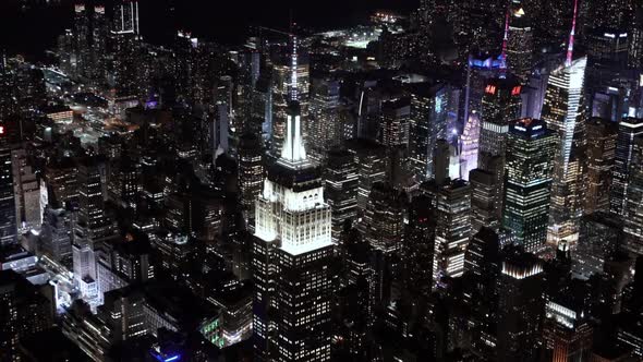 Close Up view of the Empire State Building at Night as seen from a helicopter