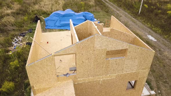 Construction of new and modern modular house. Walls made from composite wooden sip panels  alt