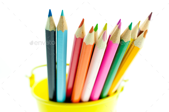 crayons in yellow bucket - Stock Photo - Images
