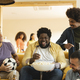 group of diverse friends meet at home on the sofa to watch football game on tv, they are nervous. - PhotoDune Item for Sale