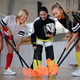 Multigenerational woman floorball team playing together in a gym. - PhotoDune Item for Sale