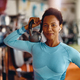 Black female athlete with kettlebell in a gym looking at camera. - PhotoDune Item for Sale