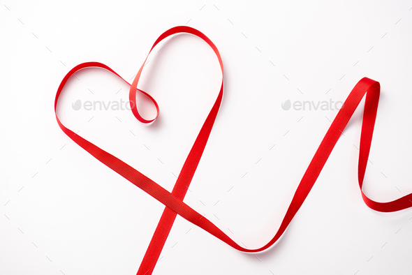 top view of red decorative heart-shaped ribbon on white - Stock Photo - Images