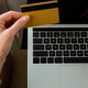 panoramic shot of businesswoman with credit card near laptop in private jet - PhotoDune Item for Sale