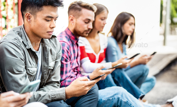 Bored people using smartphone sitting at university college campus - Stock Photo - Images