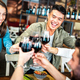Trendy multicultural friends toasting red wine at sushi poke bowl restaurant - PhotoDune Item for Sale