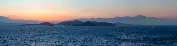 Rocky Island on Mediterranean Sea.  Rinia near Mikonos, Greece, Europe - Stock Photo - Images