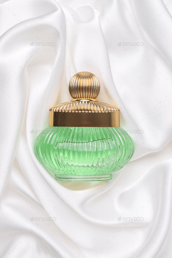 Retro fragrance bottle as luxury perfume product on white silk background.  Stock Photo by margaritaylita