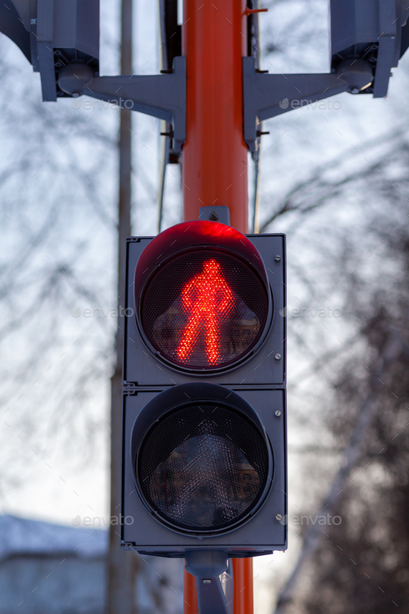 Red light on a pedestrian traffic light. Safe crossing of the road