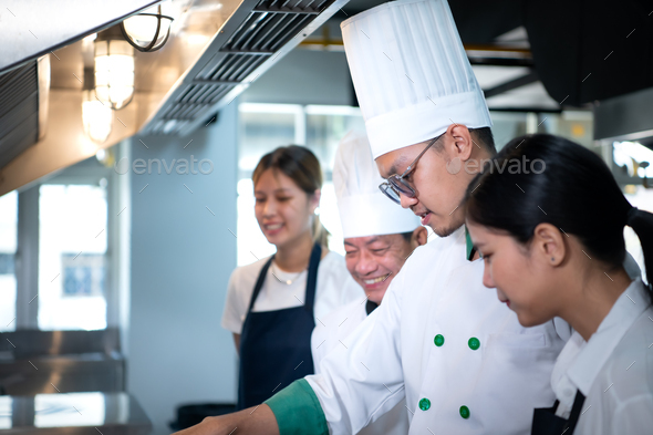 Portrait of a group of chefs and culinary students in the culinary Institute\'s kitchen.