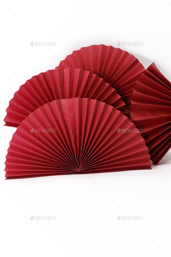 Red circle handmade paper fans on white background. Chinese New Year 2023 background