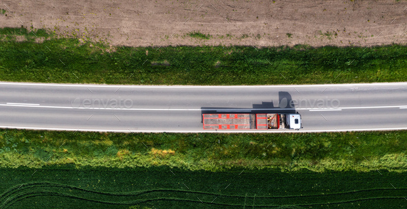 Aerial shot of truck with semi-trailer for container transport from drone pov