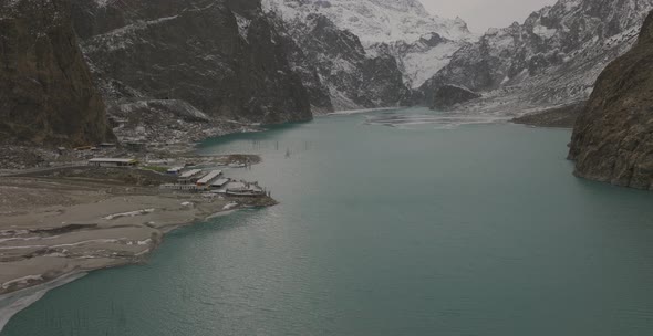Aerial Over Attabad Lake, Revealing Mountain View, Hunza Valley. Dolly Back alt