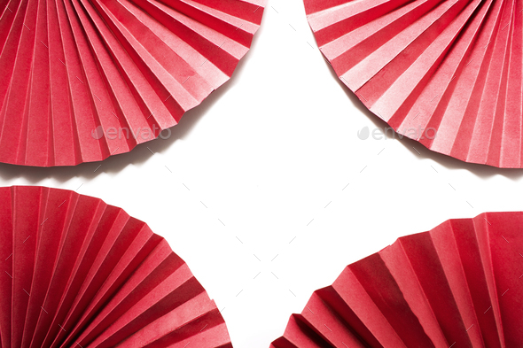 Red circle handmade paper fans on white background. Chinese New Year 2023 background