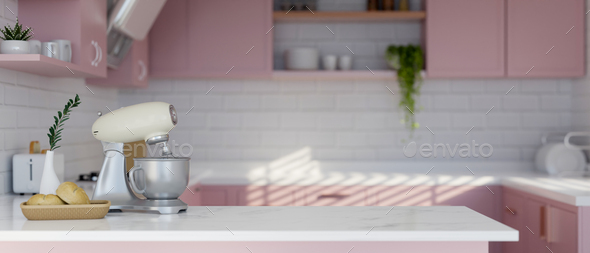 Empty space on tabletop with dough mixer, bread basket and decor in minimal pastel pink kitchen