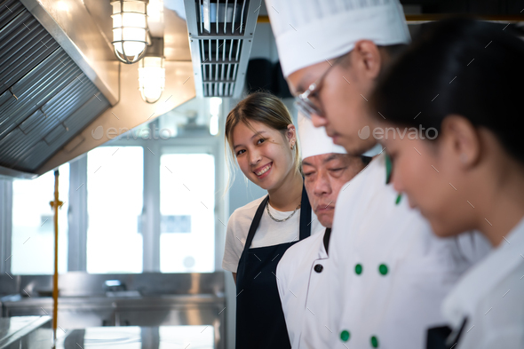 Portrait of a group of chefs and culinary students in the culinary Institute\'s kitchen.