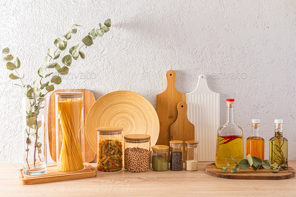 a set of various filled jars for storing bulk products and bottles with different types of organic